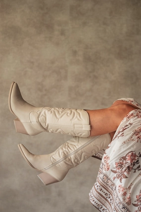 Western boots sand
